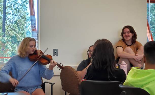 friend playing violin for my class