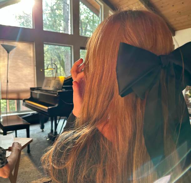 sister in front of piano